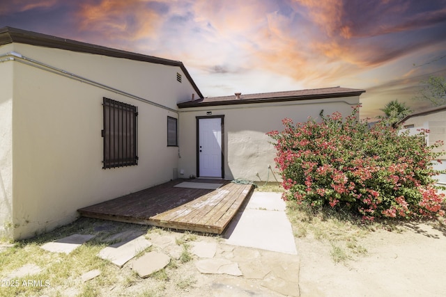 153 E Buena Vista Ave, Goodyear, AZ 85338 - exterior entry at dusk featuring stucco siding