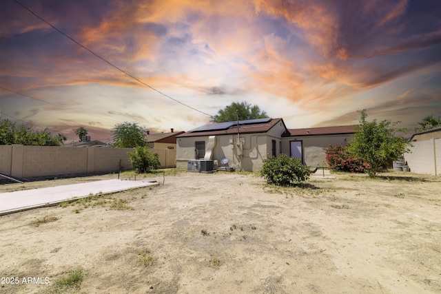 153 E Buena Vista Ave, Goodyear, AZ 85338 - rear view of property with roof mounted solar panels and stucco siding