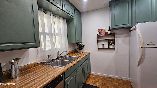 153 E Buena Vista Ave, Goodyear, AZ 85338 - kitchen with freestanding refrigerator, green cabinetry, and light countertops