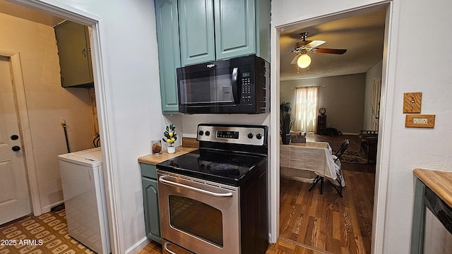 153 E Buena Vista Ave, Goodyear, AZ 85338 - kitchen with black microwave, stainless steel electric range oven, a ceiling fan, washer / clothes dryer, and blue cabinetry