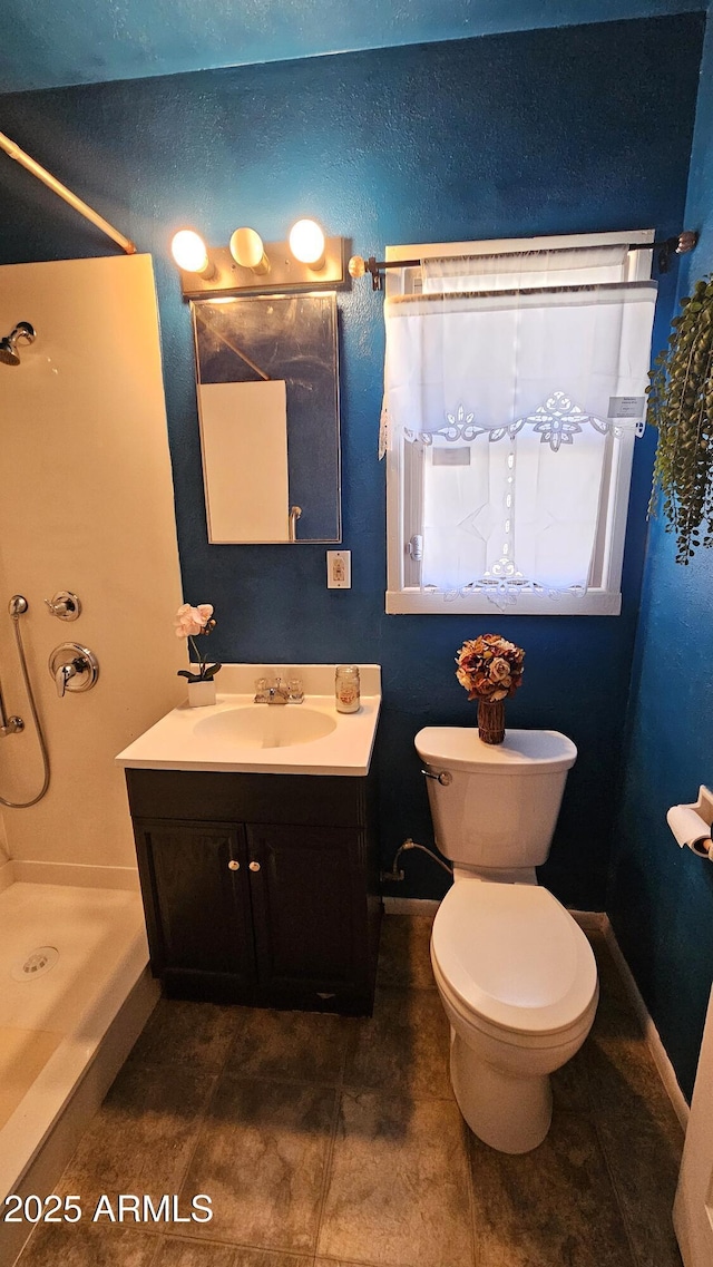 153 E Buena Vista Ave, Goodyear, AZ 85338 - full bathroom with a shower stall, vanity, and tile patterned floors