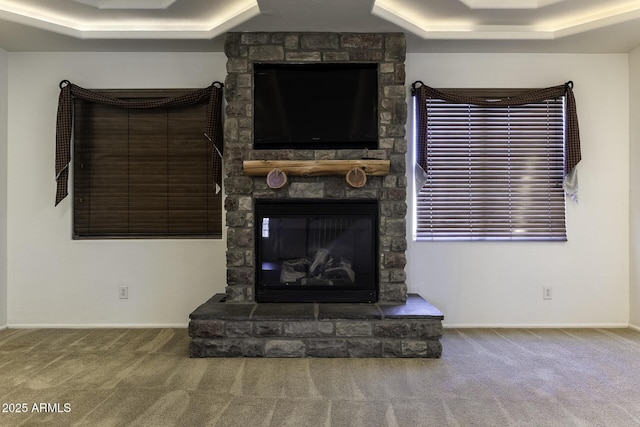 living room with carpet flooring and a fireplace