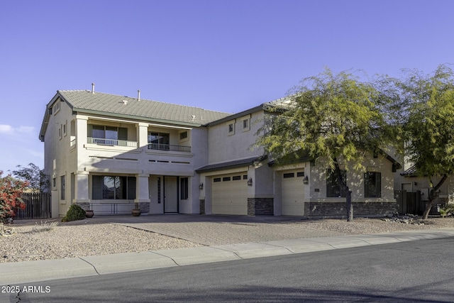 view of front of property with a balcony and a garage