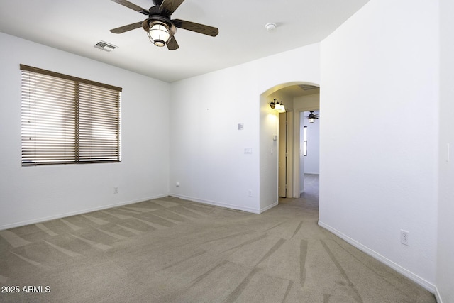 carpeted empty room with ceiling fan