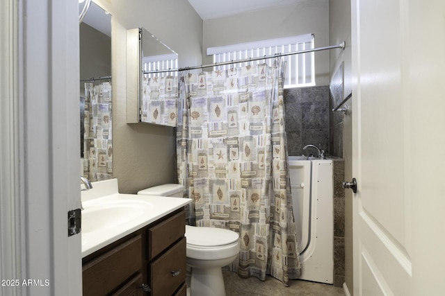 bathroom with vanity and toilet