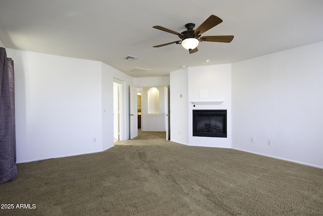 unfurnished living room with light colored carpet and ceiling fan