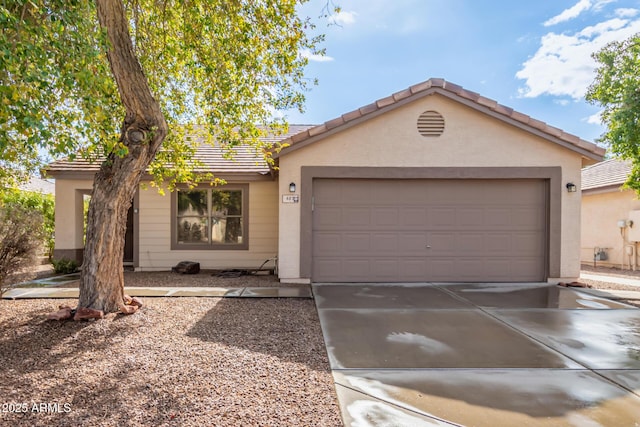 ranch-style home featuring a garage