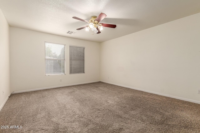 unfurnished room with a textured ceiling, carpet floors, and ceiling fan