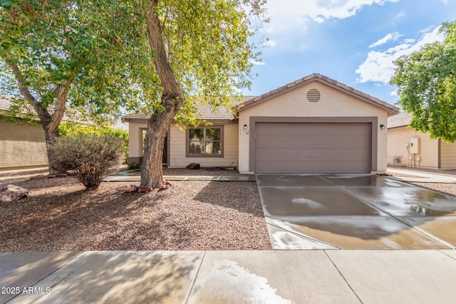 ranch-style home featuring a garage