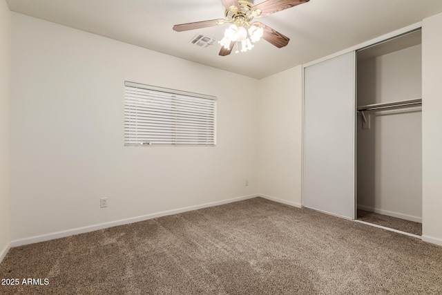 unfurnished bedroom featuring carpet floors, ceiling fan, and a closet