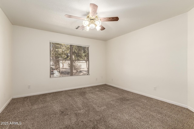 empty room with ceiling fan and carpet