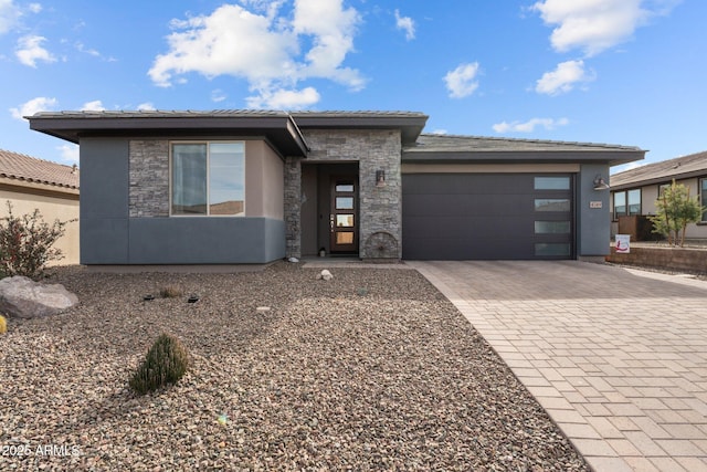 prairie-style home featuring a garage