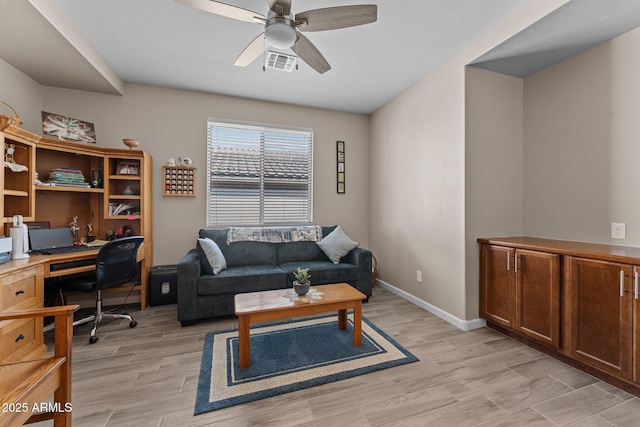 office space featuring ceiling fan and light hardwood / wood-style flooring