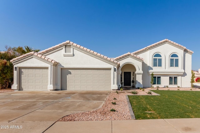 view of front of home with a garage and a front yard