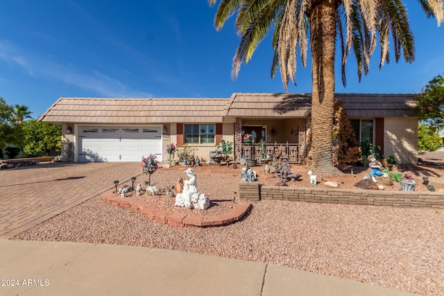 ranch-style home featuring a garage