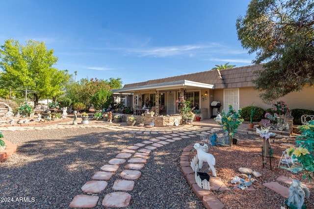 back of house with a patio