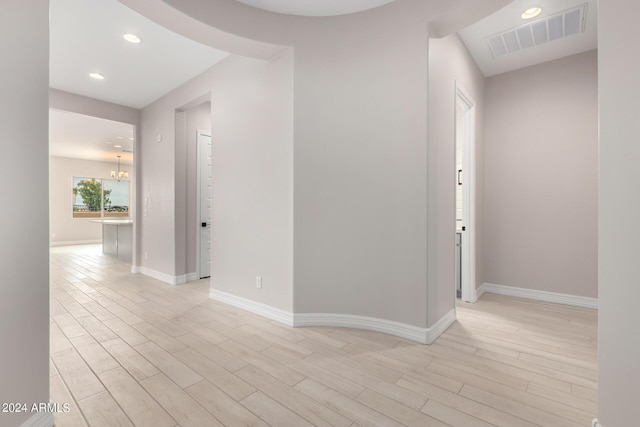 spare room featuring light wood-type flooring