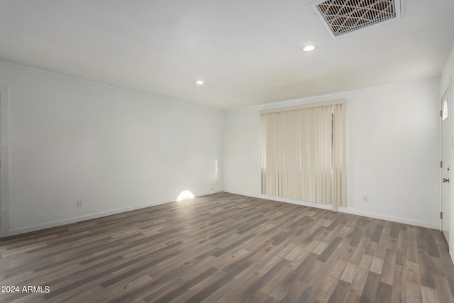 unfurnished room featuring dark hardwood / wood-style flooring