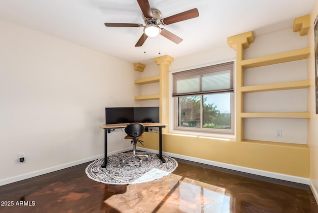 office space featuring ceiling fan and baseboards