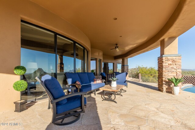 view of patio featuring an outdoor hangout area and ceiling fan