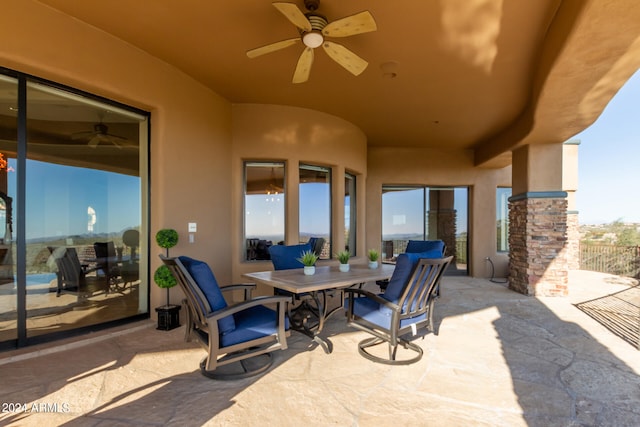 view of patio featuring ceiling fan