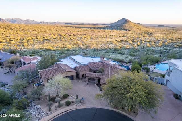 birds eye view of property with a mountain view