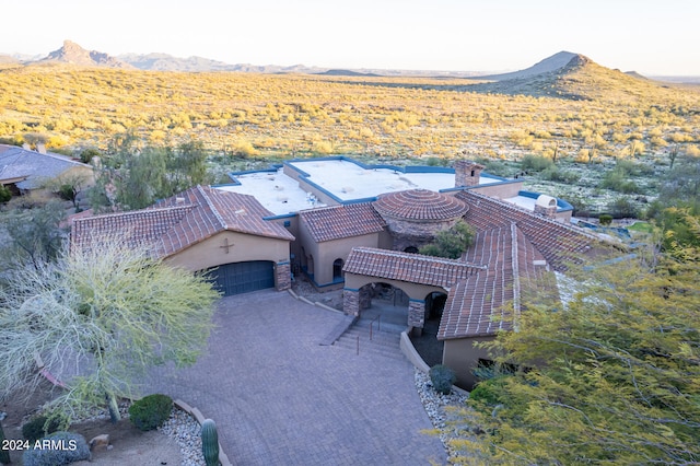 drone / aerial view featuring a mountain view