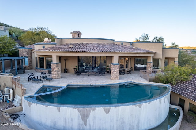 view of pool with outdoor lounge area and a patio area