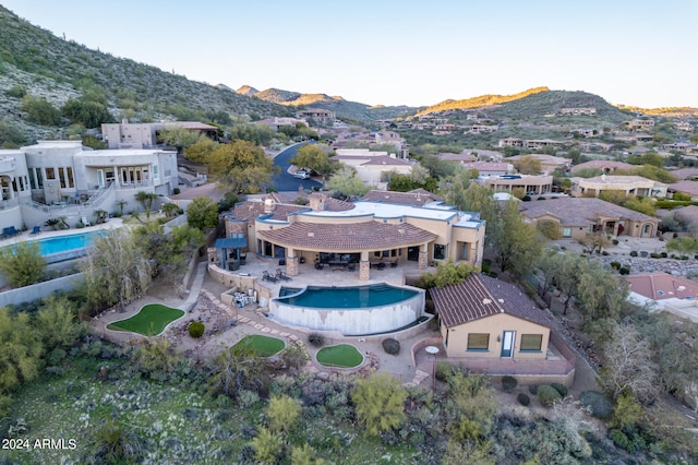 drone / aerial view featuring a mountain view