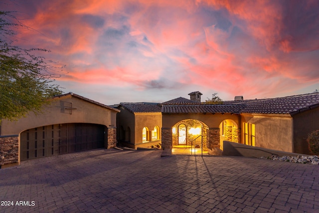 mediterranean / spanish house featuring a garage