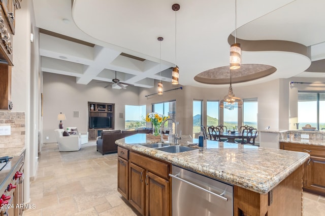 kitchen featuring a kitchen island with sink, pendant lighting, ceiling fan, dishwasher, and coffered ceiling