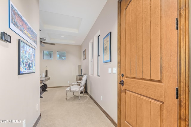 interior space featuring ceiling fan and light colored carpet