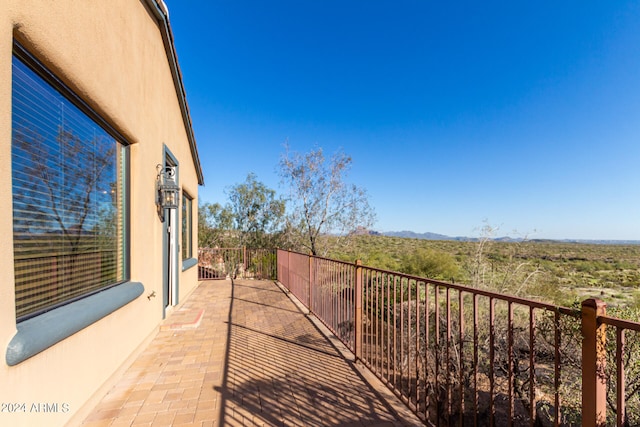 view of patio with a balcony