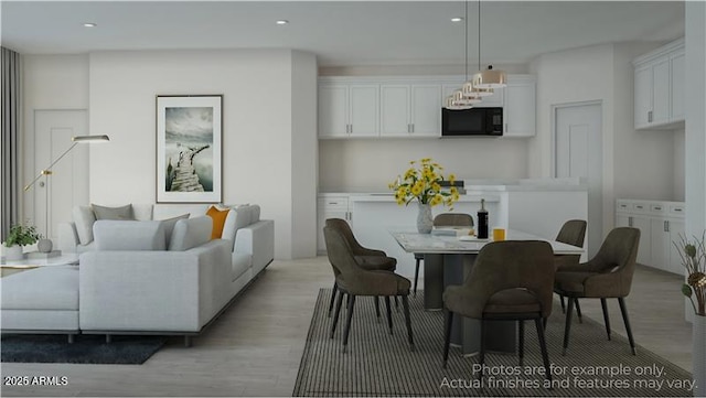 dining space with light hardwood / wood-style flooring