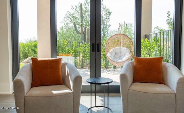 living area featuring hardwood / wood-style flooring and french doors