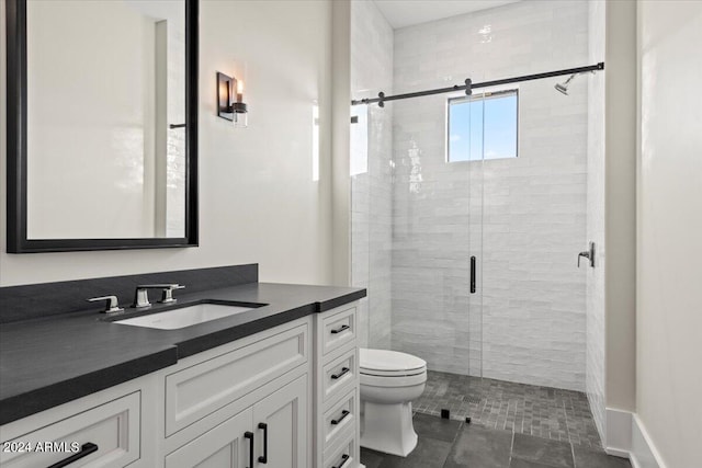 bathroom with vanity, an enclosed shower, tile patterned flooring, and toilet