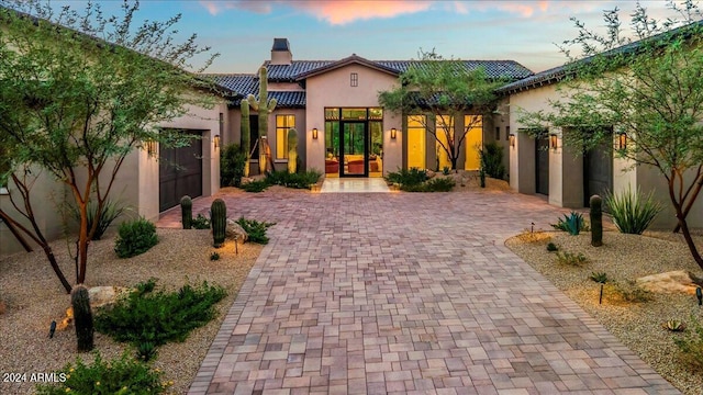 mediterranean / spanish-style house featuring a garage