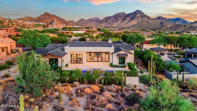 view of front of home featuring a mountain view