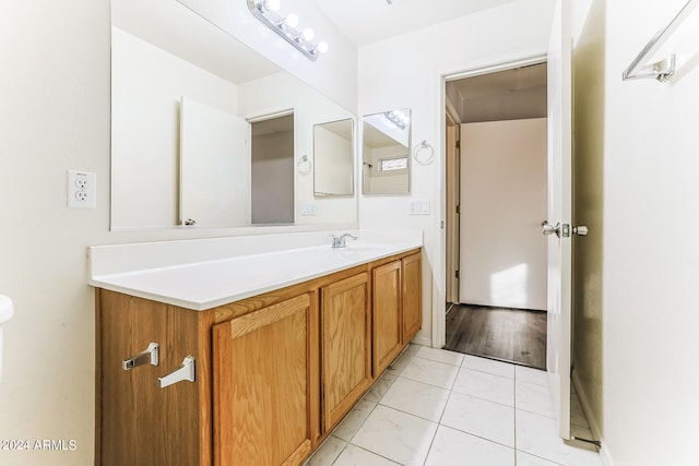 bathroom featuring vanity and wood-type flooring