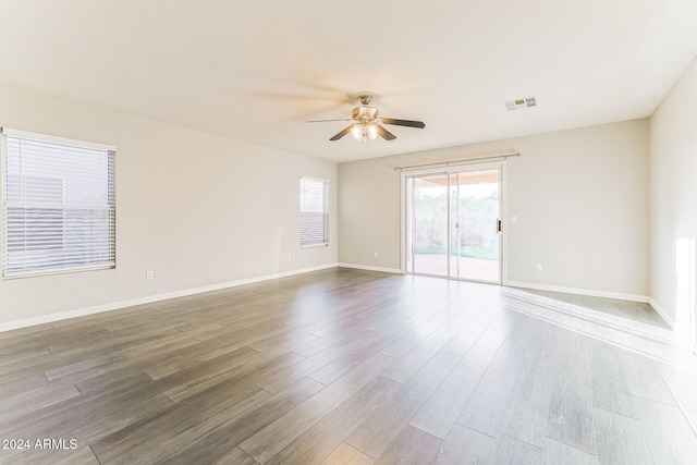 spare room featuring ceiling fan and hardwood / wood-style flooring