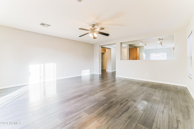 unfurnished living room with hardwood / wood-style floors and ceiling fan