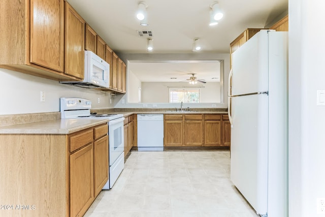 kitchen featuring white appliances, ceiling fan, and sink