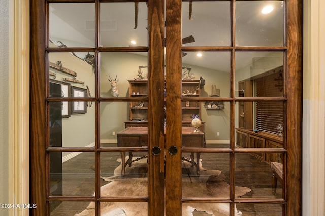 wine area with french doors and vaulted ceiling