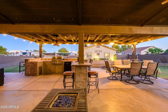 view of patio / terrace featuring a grill and a bar