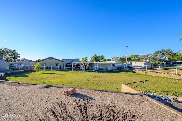 rear view of property with a lawn