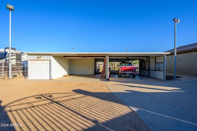 garage featuring a carport