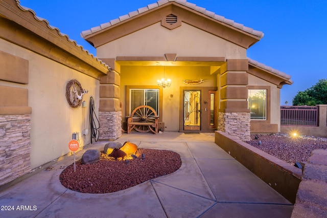 5701 N 105th Ln, Glendale, AZ 85307 - property entrance featuring a tile roof and stucco siding