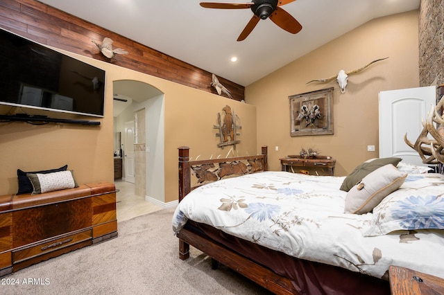 carpeted bedroom featuring ceiling fan and lofted ceiling