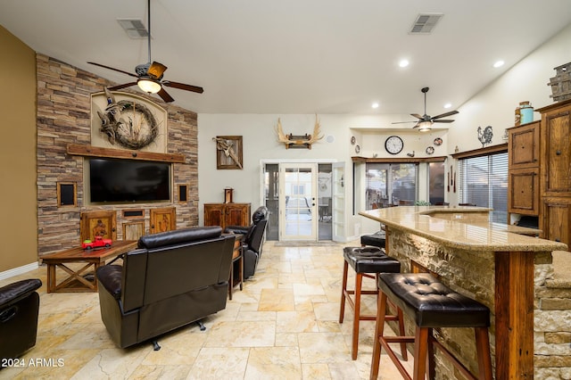 living room featuring french doors, high vaulted ceiling, and ceiling fan