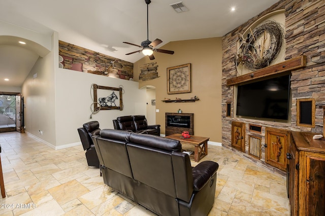 living room featuring ceiling fan and high vaulted ceiling